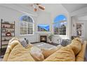 Living room features a fireplace and large windows at 6817 S Webster St # C, Littleton, CO 80128