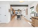 Open-concept kitchen with large island, stainless steel appliances, and seamless flow to living area at 2702 Lowell Blvd, Denver, CO 80211