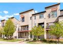 Modern townhomes boast clean lines, balconies, and well-maintained landscaping at 8953 E Northfield Blvd, Denver, CO 80238