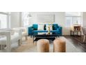 Beautiful living room featuring a cozy seating arrangement and stylish decor with bright accents at 8953 E Northfield Blvd, Denver, CO 80238
