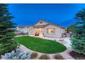 Well-maintained backyard with lush lawn and patio, perfect for outdoor relaxation and entertainment at 3242 Waterfront Dr, Monument, CO 80132