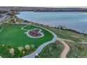 Lakeside park with playground and paths create an inviting atmosphere, providing scenic views and recreational opportunities at 3242 Waterfront Dr, Monument, CO 80132