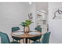 Well-staged dining room showcases a stylish modern aesthetic with adjacent access to kitchen at 1060 S Parker Rd # 36, Denver, CO 80231