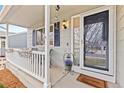 Inviting front porch with seating, decorative plants, and a 'Welcome' mat, creating a cozy entrance at 5426 Bobcat St, Frederick, CO 80504