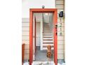 Inviting entryway with view of staircase and dog at 1218 Perry St, Denver, CO 80204