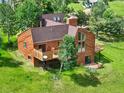 Aerial view of the well maintained wood home, with multiple decks, in a park-like setting at 953 Gilia Dr, Golden, CO 80401