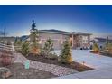 Attractive single-Gathering home boasting stone details and landscaping, offering great curb appeal at 4213 Hickory Oaks St, Castle Rock, CO 80104