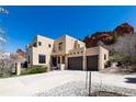 Attractive two-story home with attached garage and a well-maintained concrete driveway at 5668 Red Fern Ct, Littleton, CO 80125