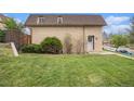 Lovely home with green lawn and mature landscaping, creating a welcoming outdoor space at 5573 S Lowell Blvd, Littleton, CO 80123