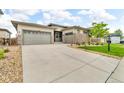 Beautiful single-Gathering home featuring stone accents, a two-car garage, and a spacious driveway at 19409 W 88Th Dr, Arvada, CO 80007