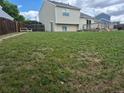 Spacious backyard with ample green space, offering great potential for outdoor activities and entertaining at 1415 S Pitkin Ct, Aurora, CO 80017