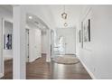 Bright and airy entryway with neutral colors and wood-look flooring at 22586 E Union Cir, Aurora, CO 80015