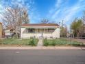 Cozy one-story house with a fenced front yard, perfect for a starter home at 7881 Kenwood St, Commerce City, CO 80022