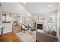 Spacious living room with fireplace and hardwood floors at 9777 W Stanford Ave, Denver, CO 80123