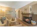 Inviting living room features a cozy fireplace, neutral tones, and modern decor at 6011 Yarrow St # C, Arvada, CO 80004