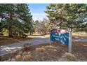 City of Arvada Memorial Park sign with walking trail, trees, and beautiful landscape at 6011 Yarrow St # C, Arvada, CO 80004