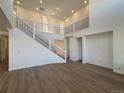 Spacious living room with high ceilings and hardwood floors at 2904 S Poppy St, Morrison, CO 80465