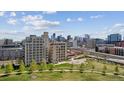 A stunning aerial view of buildings, parks and a city skyline from a beautiful residential area at 2000 Little Raven St # 4A, Denver, CO 80202