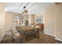 Modern dining room with updated flooring and a stylish light fixture at 5010 Apache Creek Rd, Castle Rock, CO 80109