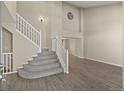 Open floorplan with a large staircase and updated flooring throughout at 5010 Apache Creek Rd, Castle Rock, CO 80109
