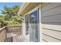 Balcony with wood deck and railings, with sliding glass doors at 1470 S Quebec Way # 244, Denver, CO 80231