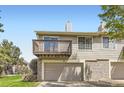 Exterior of home featuring attached garage and balcony deck at 1470 S Quebec Way # 244, Denver, CO 80231