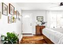 Bright entryway with hardwood floors, white door, and gallery wall at 4612 S Coors Ct, Morrison, CO 80465