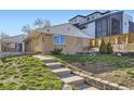 Charming, well-maintained single-story home with a brick facade and inviting walkway, set on a beautifully landscaped lot at 951 Tennyson St, Denver, CO 80204