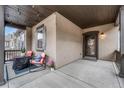 View of the home's entryway showcasing a covered front porch, perfect for enjoying the outdoors at 692 Sage Forest Ln, Monument, CO 80132