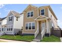 Charming two-story home with a well-manicured lawn and inviting front entrance and stairs at 245 Washington St, Erie, CO 80516