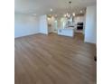 Open-concept living room and kitchen with hardwood floors and recessed lighting at 245 Washington St, Erie, CO 80516
