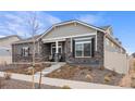 Charming single-Gathering home with stone accents, a cozy front porch, and professionally landscaped yard at 5108 N Quatar St, Aurora, CO 80019