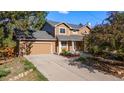 Inviting home featuring a spacious driveway and attached garage at 308 Oswego St, Aurora, CO 80010