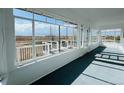 Enclosed porch offers panoramic views of surrounding landscape at 17362 County Road 29, Platteville, CO 80651