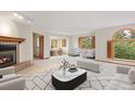Bright living room with fireplace, large windows, and modern furnishings at 761 Carr St, Lakewood, CO 80214