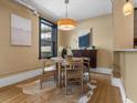 Cozy dining area with round table and cowhide rug next to the window at 740 N Sherman St # 208, Denver, CO 80203