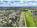 Expansive aerial shot showcases the community, surrounding landscape and golf course views of the property at 5409 Sedona Dr, Parker, CO 80134
