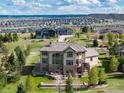 Aerial view of the property featuring manicured landscaping and mountain views at 5409 Sedona Dr, Parker, CO 80134