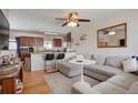 Inviting living room with an open layout, seamlessly connecting to the kitchen area at 3423 S Glencoe St, Denver, CO 80222