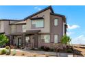 Attractive home exterior boasting stylish design elements and well-maintained landscaping under a bright, sunny sky at 6393 N Malaya St, Aurora, CO 80019