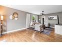 Cozy living room with hardwood floors, neutral walls, ample seating, and contemporary decor at 133 Heritage Ave, Castle Rock, CO 80104