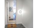 Bright entryway featuring a stylish 'welcome' mat, modern lighting, and a glimpse into the home's inviting interior at 2550 Lawrence St # 106, Denver, CO 80205