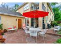 Spacious backyard patio with outdoor seating, a grill, and a view of the home's exterior at 2411 S Milwaukee St, Denver, CO 80210