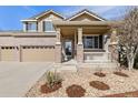 Charming home featuring stone and rock landscaping and a covered porch at 512 Cardens Pl, Erie, CO 80516