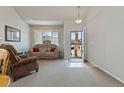 Cozy living room showcasing neutral colors, and lots of natural light at 512 Cardens Pl, Erie, CO 80516