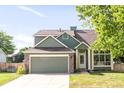 Charming two-story home with attached two car garage and stone detailing at 19428 E Crestridge Cir, Centennial, CO 80015