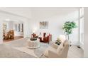 Bright living room with vaulted ceilings and an open concept layout to dining room at 19428 E Crestridge Cir, Centennial, CO 80015