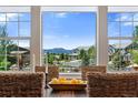 Picture window view of the neighborhood and mountains at 16069 Pikes Peak Dr, Broomfield, CO 80023