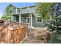 Charming home with a covered front porch and attractive landscaping at 22 Apache Plume St, Brighton, CO 80601