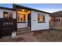 Charming home featuring a quaint yard, sidewalk, and minimalist landscaping, perfect for modern living at 2855 Albion St, Denver, CO 80207